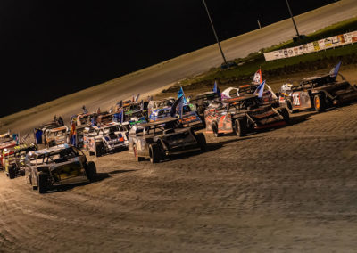 A dirt track race with drivers using Quick Rescue Roof